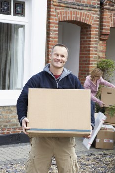 Man and van loading furniture for a move in Acton