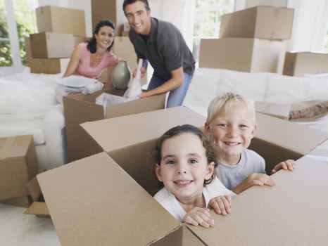 House removals team loading boxes and furniture for a move in Acton