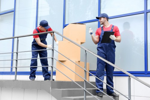 Man and van team loading household items for transport