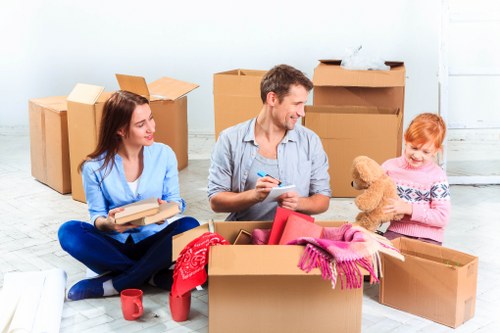 Removals team preparing a same day move in Acton residential street