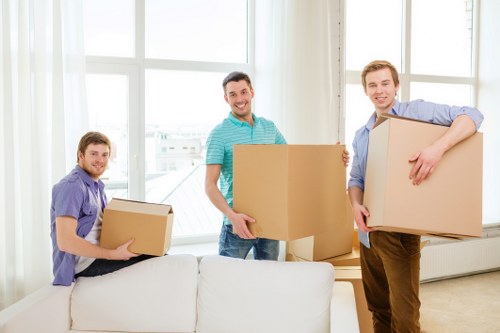 Loading furniture into a moving truck in Acton
