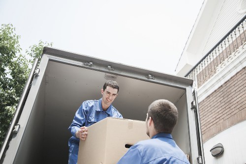 Packed boxes and furniture ready for a local removal service in Acton